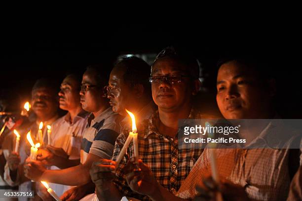 Indigenous people light candles at Central Shahid Minar in Dhaka, to celebrate the International Day of the World's Indigenous People 2014. The...