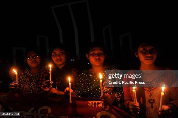 Indigenous people light candles at Central Shahid Minar in Dhaka, to celebrate the International Day of the World's Indigenous People 2014. The...