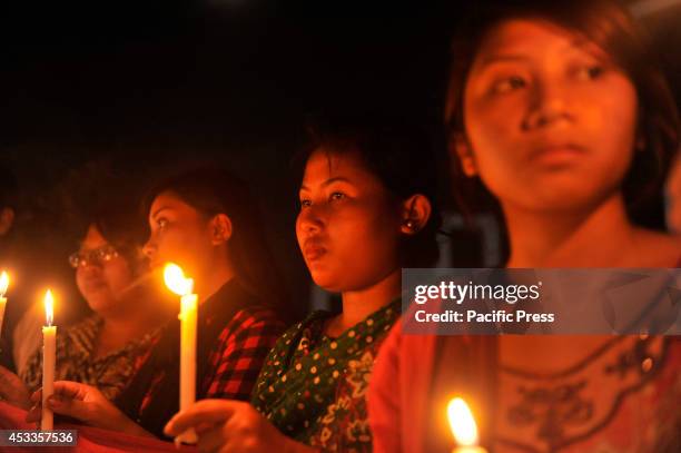 Indigenous people light candles at Central Shahid Minar in Dhaka, to celebrate the International Day of the World's Indigenous People 2014. The...