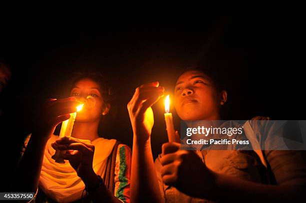 Indigenous people light candles at Central Shahid Minar in Dhaka, to celebrate the International Day of the World's Indigenous People 2014. The...