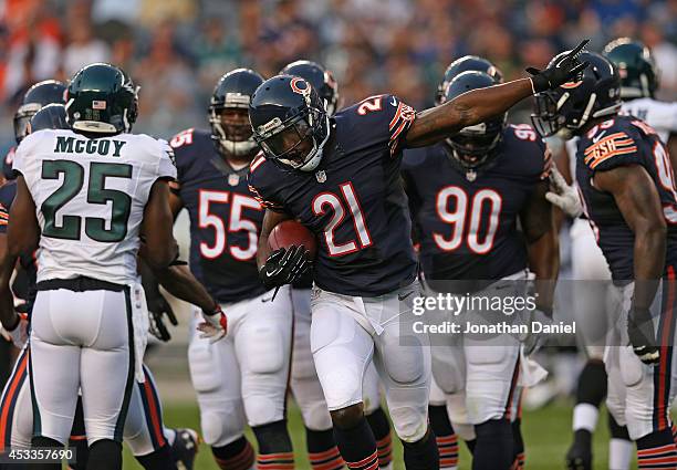 Ryan Mundy of the Chicago Bears celebrates his first quarter interception of a pass by Nick Foles of the Philadelphia Eagles during a preseason game...