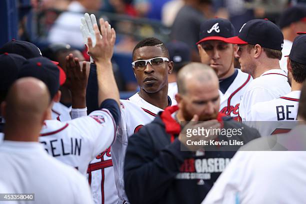 Upton of the Atlanta Braves celebrates with teammates after hitting a two run home run against the Washington Nationals during the second inning at...