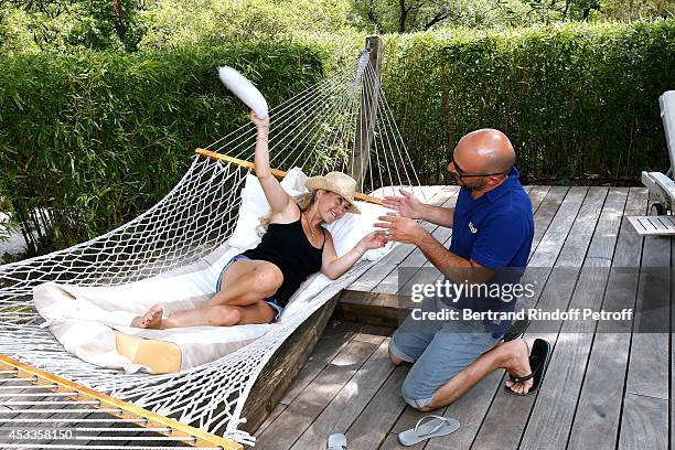 Humorist Christelle Chollet and her husband, producer and scenarist Remy Caccia attend the lunch at Jacqueline Franjou's house, as part of the 30th...