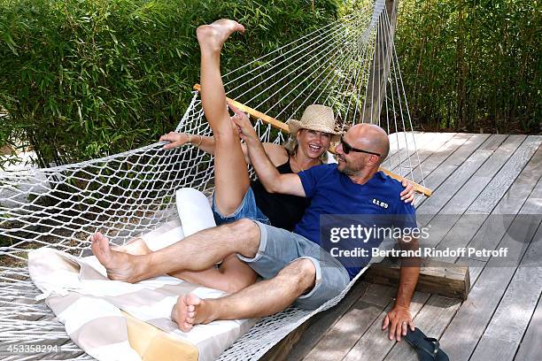 Humorist Christelle Chollet and her husband, producer and scenarist Remy Caccia attend the lunch at Jacqueline Franjou's house, as part of the 30th...