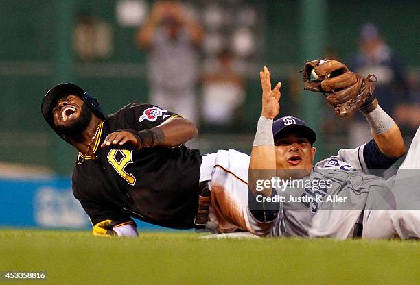 Josh Harrison of the Pittsburgh Pirates reacts after being injured while attempting to steal second base in the fifth inning against Everth Cabrera...