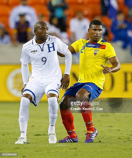 Jerry Palacios of Honduras against Jorge Guagua of Ecuador during an international friendly match at BBVA Compass Stadium on November 19, 2013 in...