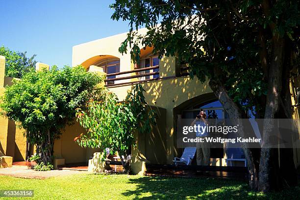 Botswana, Chobe National Park, Chobe Game Lodge, Bungalows, Tourist Looking For Game.