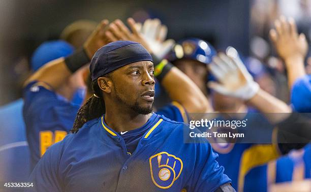 Rickie Weeks of the Milwaukee Brewers looks out of the dugout after hitting a three-run homer off of Carlos Frias of the Los Angeles Dodgers at...