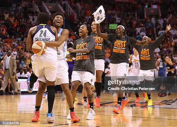 Eastern Conference All-Star Angel McCoughtry of the Atlanta Dream and Tamika Catchings of the Indiana Fever celebrate after defeating the Western...