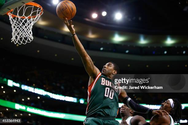 Mayo of the Milwaukee Bucks attempts a layup against the Boston Celtics in the fourth quarter during the game at TD Garden on December 3, 2013 in...