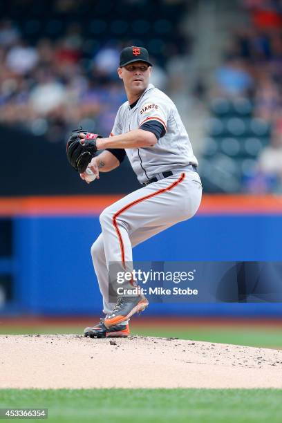 Tim Hudson of the San Francisco Giants pitches against the New York Mets at Citi Field on August 4, 2014 in the Flushing neighborhood of the Queens...