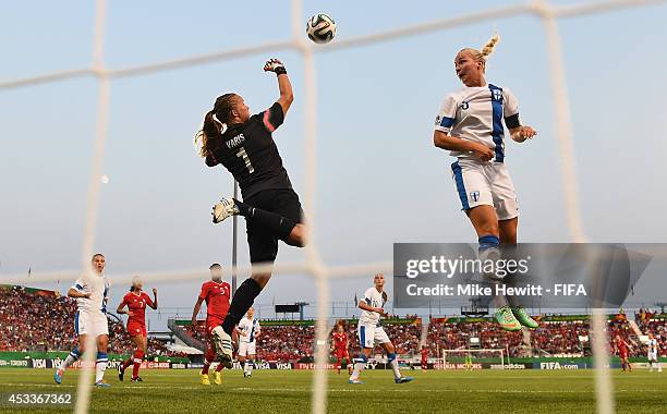 Goalkeeper Vera Varis of Finland punches clear as team mate Emilia Iskanius looks on during the FIFA U-20 Women's World Cup Canada 2014 Group A match...