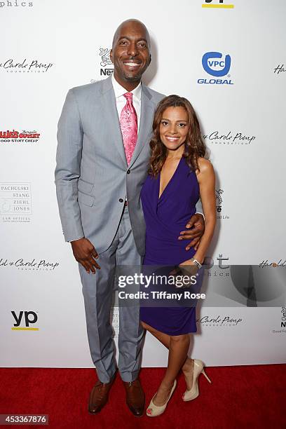 Basketball player John Salley and Natasha Scott attend the 14th Annual Harold & Carole Pump Foundation Event on August 8, 2014 in Los Angeles,...