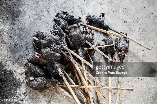 Bats ready to roast at Langowan traditional market on August 9, 2014 in Langowan, North Sulawesi. The Langowan traditional market is famous for...