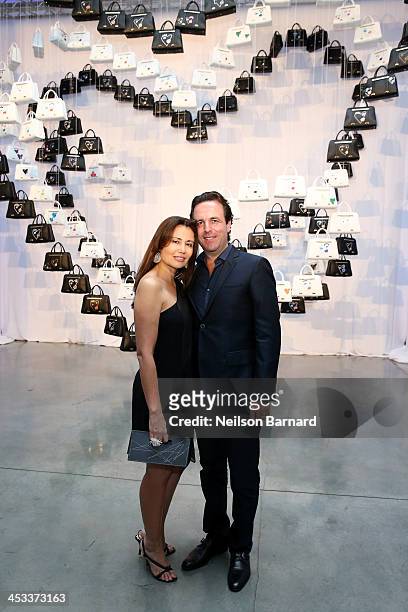Florian Haffa and Jeanine Haffa attends the Porsche Design x Thierry Noir Art Basel Miami Beach Event at The Temple House on December 3, 2013 in...