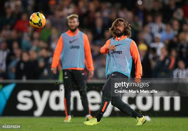 Andrea Pirlo passes during a Juventus training session at WIN Jubilee Stadium on August 9, 2014 in Sydney, Australia.