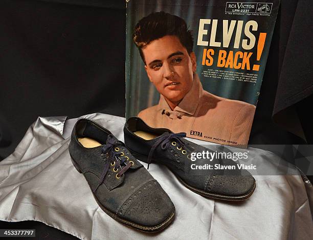 Elvis Presley's blue suede size 10 shoes from 1960 on display at "Icons & Idols: Rock n' Roll" on December 3, 2013 in New York City.