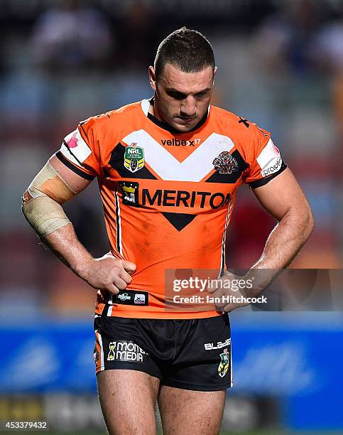 Robbie Farah of the Tigers looks dejected during the round 22 NRL match between the North Queensland Cowboys and the Wests Tigers at 1300SMILES...