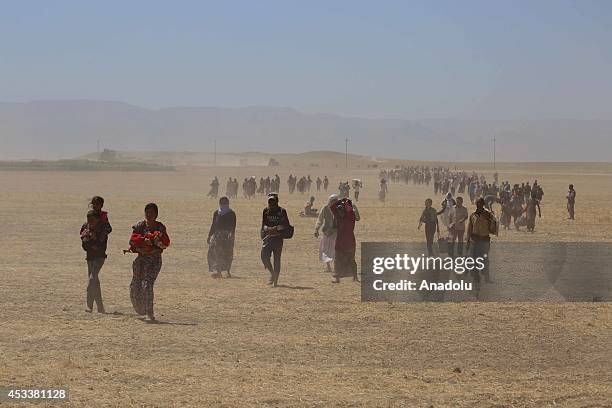 Thousands of Yezidis trapped in the Sinjar mountains as they tried to escape from Islamic State forces, are rescued by Kurdish Peshmerga forces and...