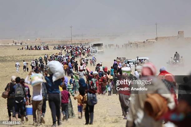 Thousands of Yezidis trapped in the Sinjar mountains as they tried to escape from Islamic State forces, are rescued by Kurdish Peshmerga forces and...