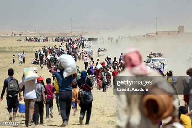 Thousands of Yezidis trapped in the Sinjar mountains as they tried to escape from Islamic State forces, are rescued by Kurdish Peshmerga forces and...