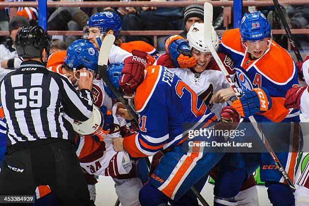 Jordan Eberle, Andrew Ference and Ryan Nugent-Hopkins of the Edmonton Oilers mix it up against Tim Kennedy and Jordan Szwarz of the Phoenix Coyotes...