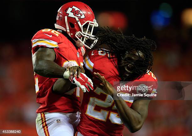 Cyrus Gray of the Kansas City Chiefs is congratulated bu Jamaal Charles after scoring a touchdown during the preseason game against the Cincinnati...