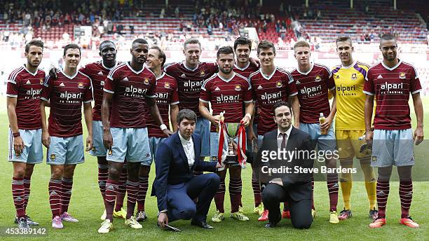 The West Ham United players pose for a team photograph with the Marathonbet Cup after their victory in the pre-season friendly match between West Ham...