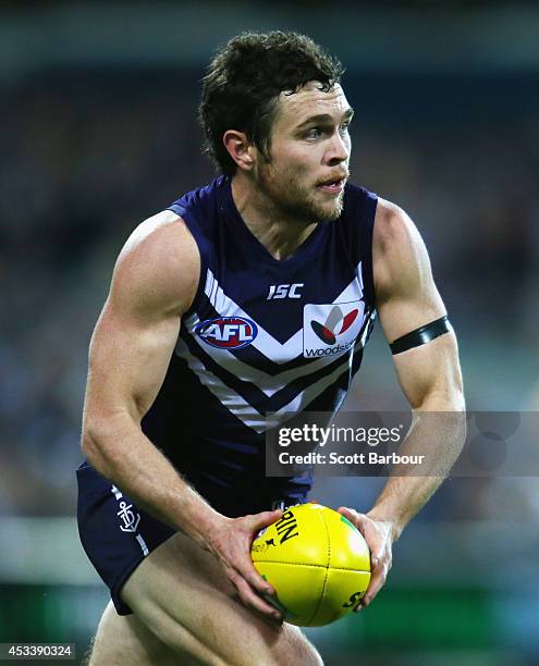 Hayden Ballantyne of the Dockers runs with the ball during the round 20 AFL match between the Geelong Cats and the Fremantle Dockers at Skilled...