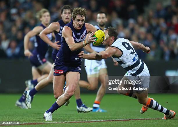 Michael Barlow of the Dockers runs with the ball during the round 20 AFL match between the Geelong Cats and the Fremantle Dockers at Skilled Stadium...