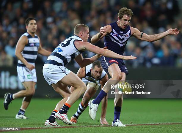 Michael Barlow of the Dockers kicks the ball during the round 20 AFL match between the Geelong Cats and the Fremantle Dockers at Skilled Stadium on...