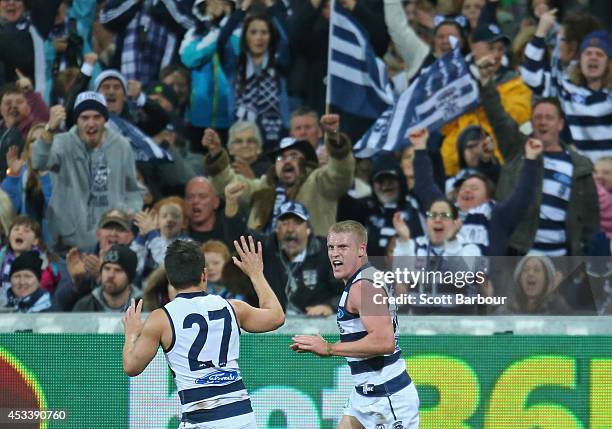 Josh Caddy of the Cats celebrates after kicking a goal during the round 20 AFL match between the Geelong Cats and the Fremantle Dockers at Skilled...