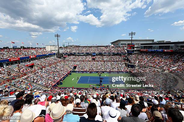 Fans watch the action between Serena Williams of the USA and Venus Williams of the USA during the women's semifinals match in the Rogers Cup at...