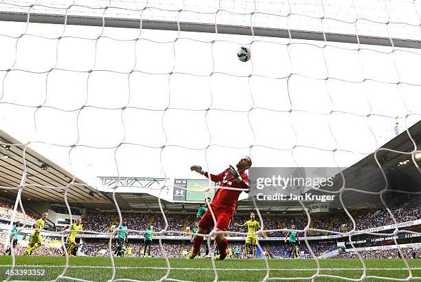 Roberto Soldado of Spurs heads the ball past Ralf Fahrmann of Schalke for his goal during a pre season friendly match between Tottenham Hotspur and...