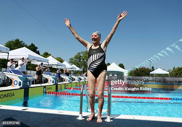 Katherine Johnstone of New Zealand waves after completing the Women's 400m Freestyle during the 15th FINA World Masters Championships at Parc...