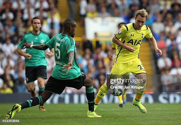 Christian Eriksen of Spurs controls the ball from Felipe Santana of Schalke during a pre season friendly match between Tottenham Hotspur and FC...