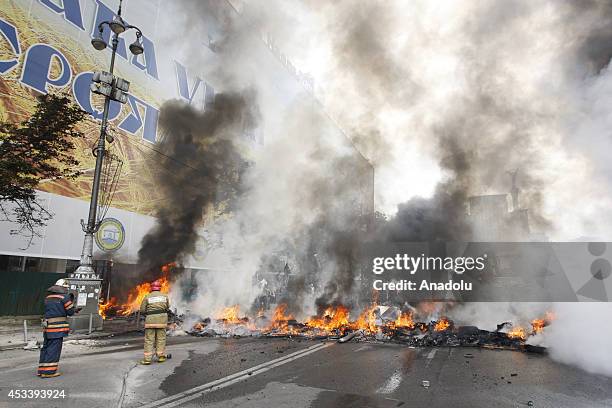 Kiev residents clash with the self defense activists as removing the tents and barricades, set by activists, from the city's central Independence...