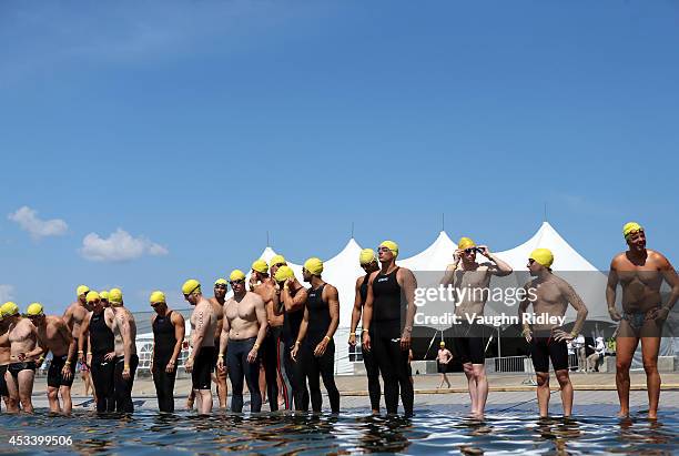 Swimmers prepare for the Men's 30-34 Age Group 3km swim during the 15th FINA World Masters Championships at Parc Jean-Drapeau on August 9, 2014 in...