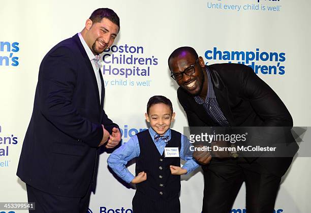 New England Patriots' Joe Vellano and Chandler Jones attend Champions for Children's with Drystan at Seaport World Trade Center on December 3, 2013...