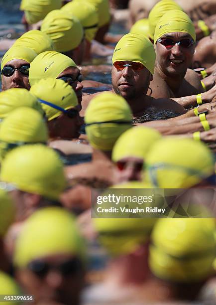 Swimmers prepare for the Men's 30-34 Age Group 3km swim during the 15th FINA World Masters Championships at Parc Jean-Drapeau on August 9, 2014 in...