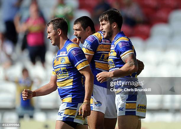 Tom Briscoe of Leeds Rhinos is is congratulated by his team-mates after going over for a try during the Tetley's Challenge Cup Semi Final match...