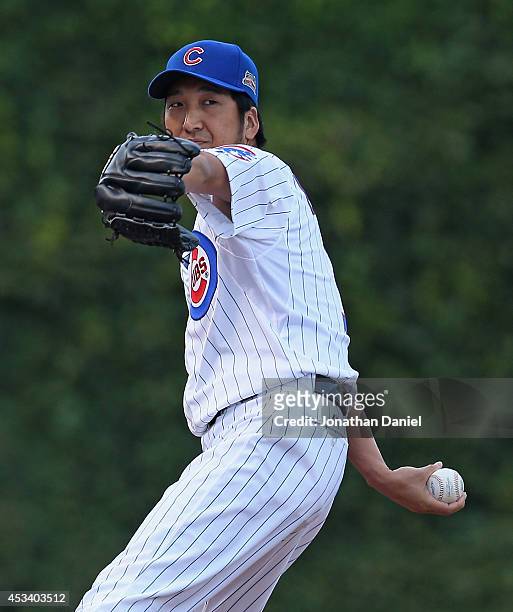 Kyuji Fujikawa of the Chicago Cubs warms-up in the bull pen during a game against the Tampa Bay Rays at Wrigley Field on August 9, 2014 in Chicago,...