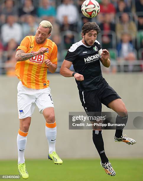 Julian Schieber and Ihsan Kalkan go up for a header during the test match between SV Rödinghausen and Hertha BSC on july 15, 2014 in Rödinghausen,...