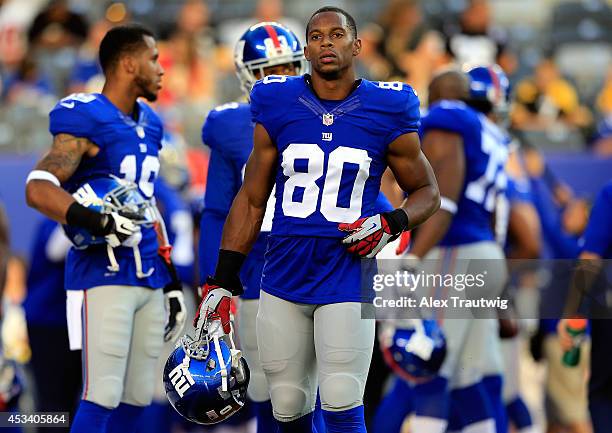 Wide receiver Victor Cruz of the New York Giants looks on prior to a preseason game against the Pittsburgh Steelers at MetLife Stadium on August 9,...