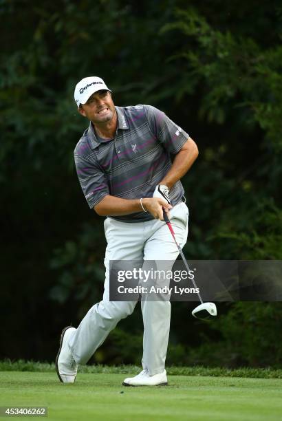 Ryan Palmer of the United States reacts to his tee shot on the 18th hole during the third round of the 96th PGA Championship at Valhalla Golf Club on...