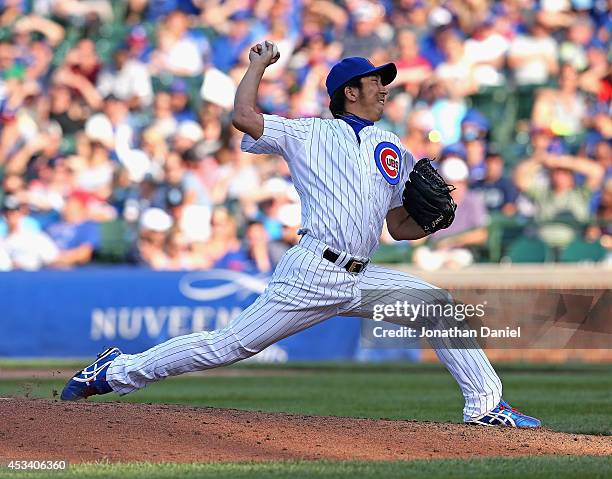 Kyuji Fujikawa of the Chicago Cubs pitches in the 9th inning against the Tampa Bay Rays at Wrigley Field on August 9, 2014 in Chicago, Illinois. The...