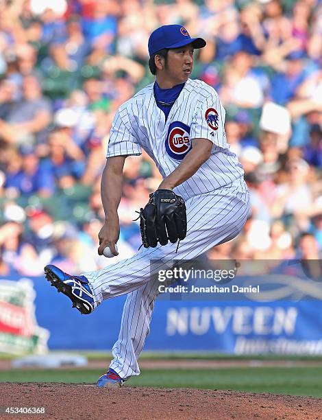 Kyuji Fujikawa of the Chicago Cubs pitches in the 9th inning against the Tampa Bay Rays at Wrigley Field on August 9, 2014 in Chicago, Illinois. The...