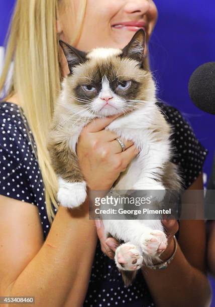 Grumpy Cat attends the "Grumpy Guide To Life: Observations From Grumpy Cat" book event at Indigo at Eaton Centre Shopping Centre on August 9, 2014 in...