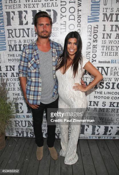 Personality Kourtney Kardashian and husband Scott Disick attend Women's Health Hosts Hamptons "Party Under The Stars" for RUN10 FEED10 at...