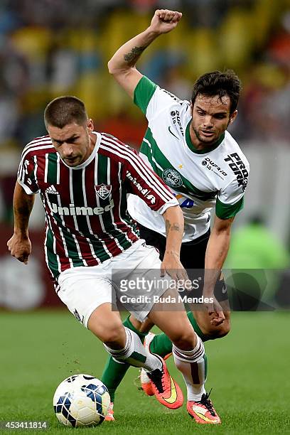Rafael Sobis of Fluminense struggles for the ball with Norberto of Coritiba during a match between Fluminense and Coritiba as part of Brasileirao...